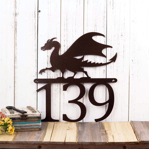 3 digit metal house number sign with a dragon silhouette, in copper vein powder coat. 