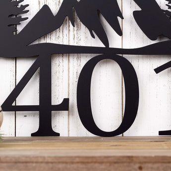 Close up of 3 digit house number on our hanging address sign, in matte black powder coat.