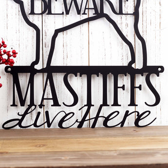 Close up of Mastiffs Live Here wording on our English Mastiff metal wall art, in matte black powder coat.
