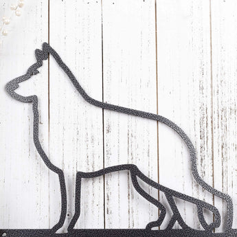 Close up of German Shepherd dog silhouette on our German Shepherd Lives Here metal sign, in silver vein powder coat.