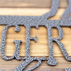 Close up of silver vein powder coat on our German Shepherds Live Here metal wall art.