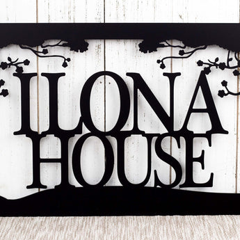 Close up of house name on our custom metal family name sign, in matte black powder coat.