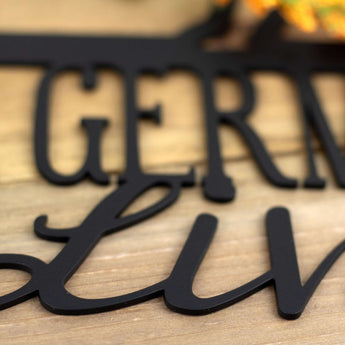 Close up of matte black powder coat on our German Shepherds Live Here metal wall art.
