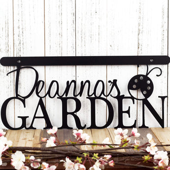 Hanging personalized garden name plaque with a ladybug, in matte black powder coat. 