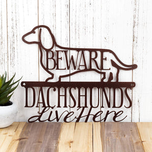 Dachshunds Live Here metal wall art, with Beware, in copper vein powder coat. 