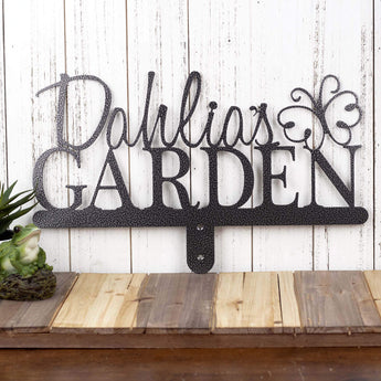 Garden metal name sign with script first name, with a butterfly, in silver vein powder coat. 