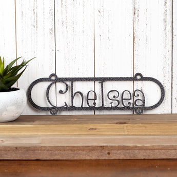 Close up of child name on our custom metal sign, in silver vein powder coat. 