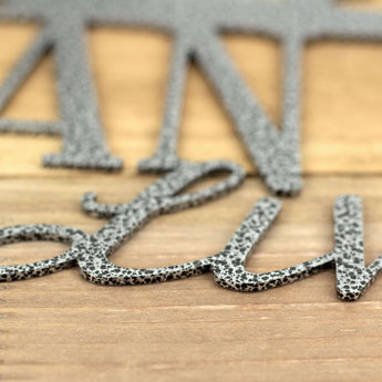 Close up of silver vein powder coat on our Eskies metal wall art. 