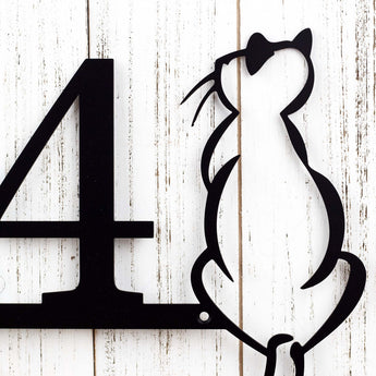 Close up of cat silhouette on our metal house number, in matte black powder coat.