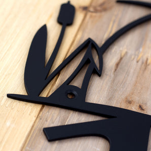 Close up of matte black powder coat on our 3 digit heron & cattails metal house number sign. 