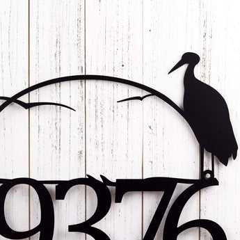 Close up of heron on our metal house number sign, in matte black powder coat.