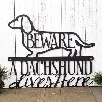 A Dachshund Lives Here metal wall art, with Beware, in matte black powder coat. 