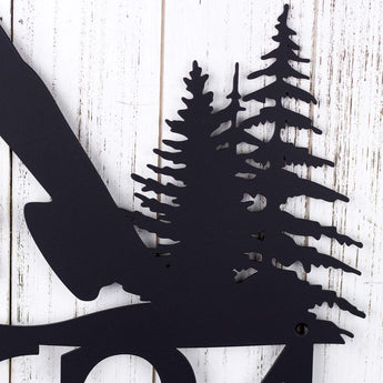Close up of mountains and pine trees on our 5 digit metal house number plaque in matte black powder coat. 