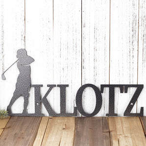 Personalized metal sign with boy golfer and name, in silver vein powder coat. 