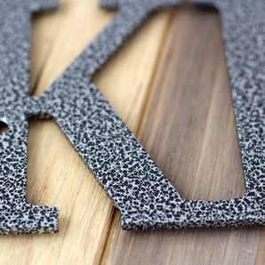 Close up of silver vein powder coat on our personalized name sign. 