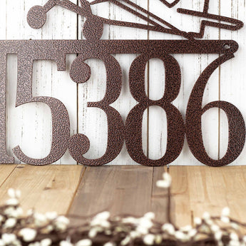 Close up of 5 digit house number on our airplane metal house number sign, in copper vein powder coat.