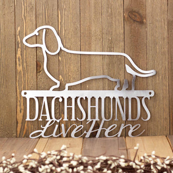 Dachshunds Live Here metal sign, in raw steel. 