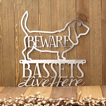 Basset hounds live here metal sign with beware, in raw steel.