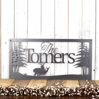 Rectangular metal family name plaque with buck and doe deer, in silver vein powder coat. 