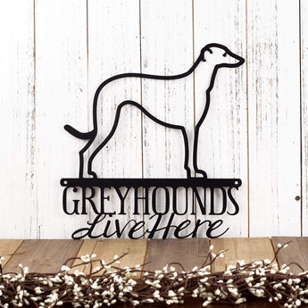 Greyhounds Live Here metal wall art, with Greyhound dog silhouette, in matte black powder coat. 
