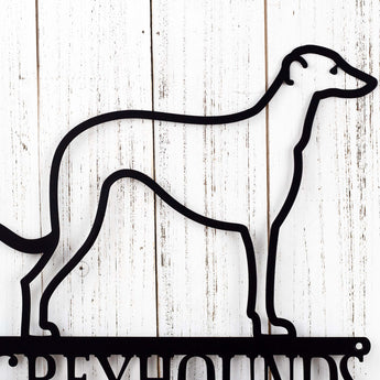 Close up of Greyhound dog silhouette on our Greyhounds Live Here metal sign, in matte black powder coat.