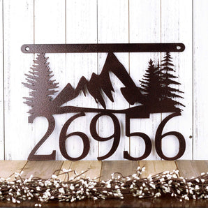 Hanging 5 digit metal house number sign with mountains and pine trees, in copper vein powder coat.