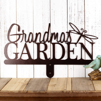 Garden metal name sign with a dragonfly silhouette, in copper vein powder coat. 