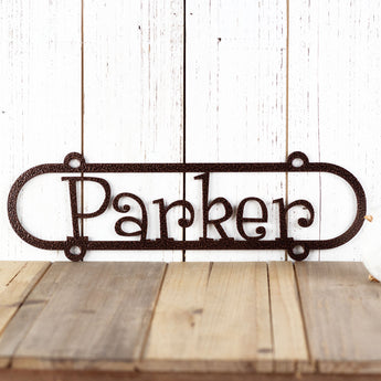 Metal oval child name sign, in copper vein powder coat. 