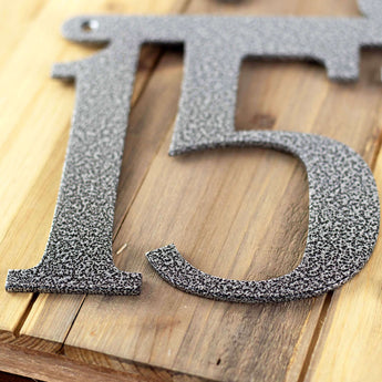 Close up of silver vein powder coat on our airplane house number sign.