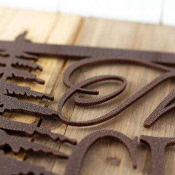 Close up of copper vein powder coat, on our custom metal sign.