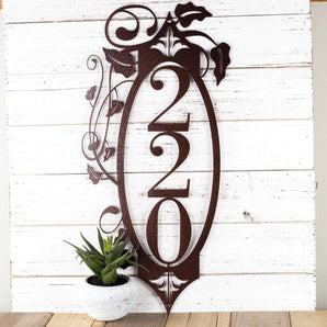 3 digit vertical metal house number sign with vines and fleur de lis, in copper vein powder coat. 