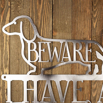 Close up of Dachshund dog silhouette on our I have a Two Foot Long Weiner metal wall art, in raw steel.