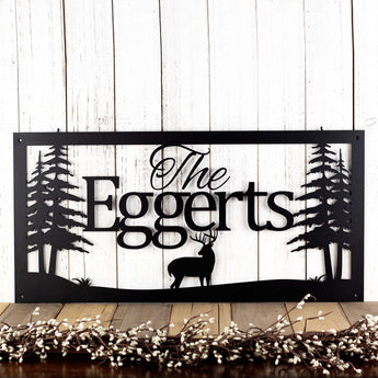 Rectangular family name metal sign with buck deer silhouette, in matte black powder coat.