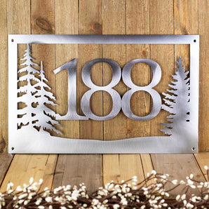 Rectangular 3 digit metal house number plaque with pine trees, in raw steel. 