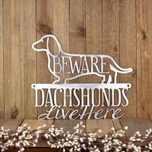 Dachshunds Live Here metal sign, with Beware, in raw steel.