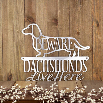 Dachshunds Live Here metal wall art, with Beware, in raw steel. 
