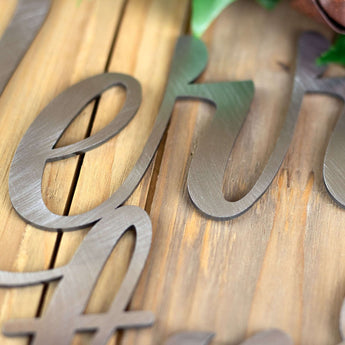 Close up of raw steel on our Merry Christmas script sign. 