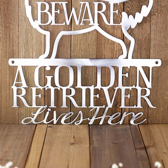 Close up of wording for our Golden Retriever Lives Here metal sign with beware, in raw steel.