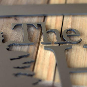 Close up of raw steel on our metal name sign.