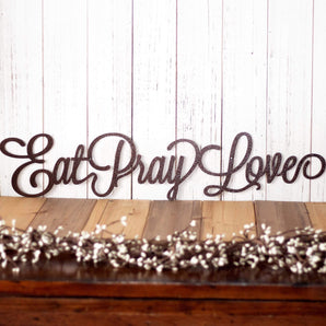 Eat Pray Love metal wall art with script lettering, in copper vein powder coat.