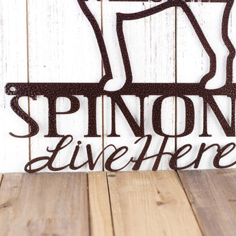 Close up of Spinoni Live Here wording on our Spinoni dog metal sign, in copper vein powder coat.