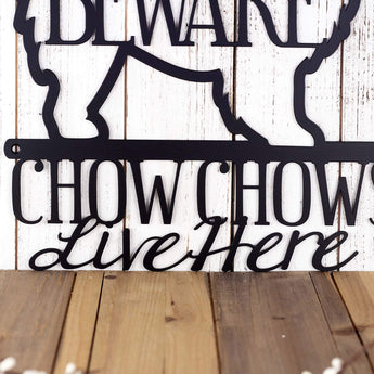 Close up of Chow Chows Live Here wording on our Chow Chow dog metal sign, in matte black powder coat. 