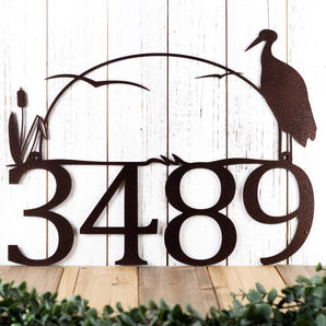 4 digit metal house number sign with heron and cattails, in copper vein powder coat. 