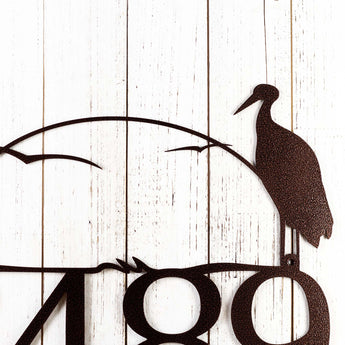 Close up of heron and cattails on our metal house number sign, in copper vein powder coat. 