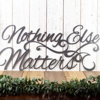 Nothing Else Matters metal wall art with scrolls, in silver vein powder coat.