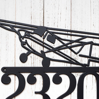 Close up of airplane silhouette on our metal house number sign, in matte black powder coat. 
