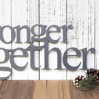 Close up of Stronger Together wording on our metal wall art, in silver vein powder coat.