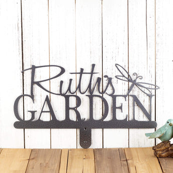 Personalized metal garden sign with first name and dragonfly image, in silver vein powder coat.