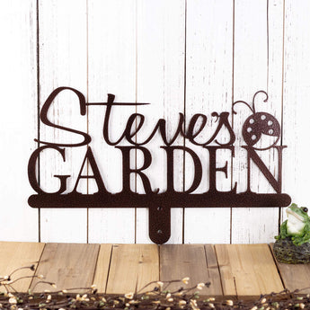 Garden name metal yard sign, with a ladybug silhouette, in copper vein powder coat. 