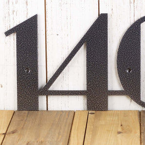 Close up of silver vein powder coat on our 3 digit modern house number.
